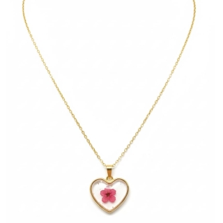 Collier inoxydable doré avec un coeur transparent