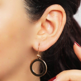 Boucle d'oreille avec roue